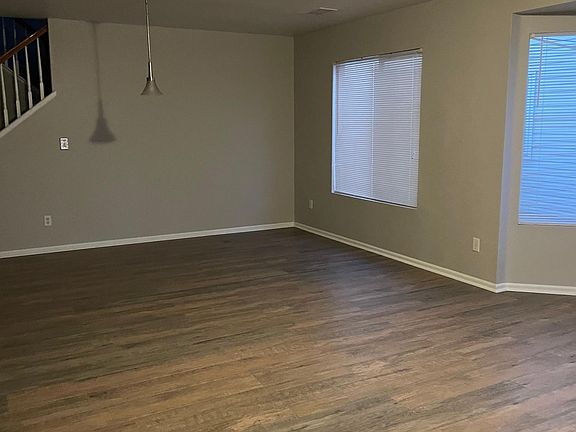 Large front room and formal dining room with new wood floors