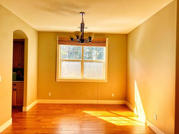 Formal dining area with access to a butler pantry connecting with the kitchen