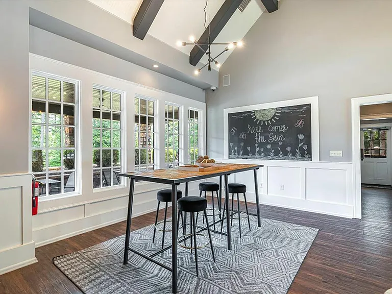 Bright and open community space at The Cottages of Hattiesburg for socializing and study.