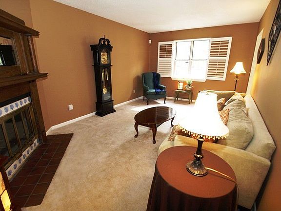 Large LR with fireplace & new plantation shutters 