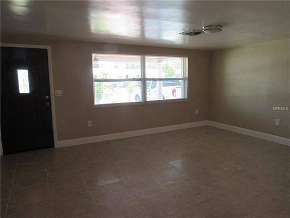 ENTRYWAY LEADS INTO THE LIVING ROOM