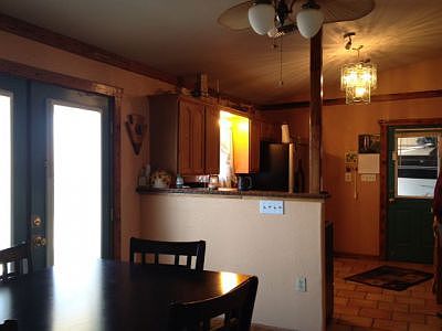 view looking at front door and kitchen