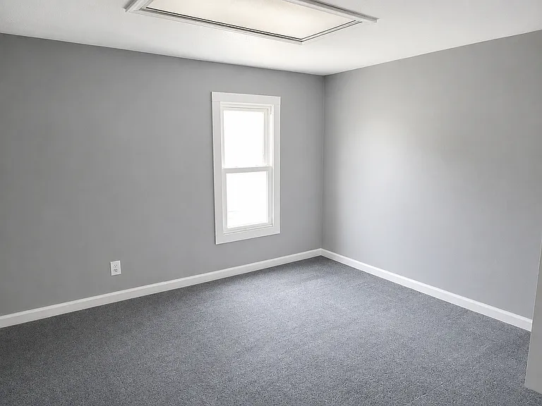 Carpeted Bedroom with Gray Walls