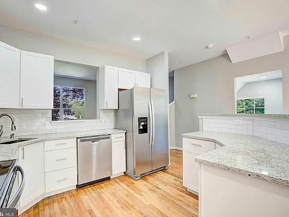 Kitchen with stainless steel appliances, including a brand new dishwasher