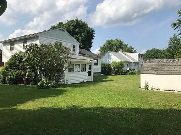 Back of house with shed