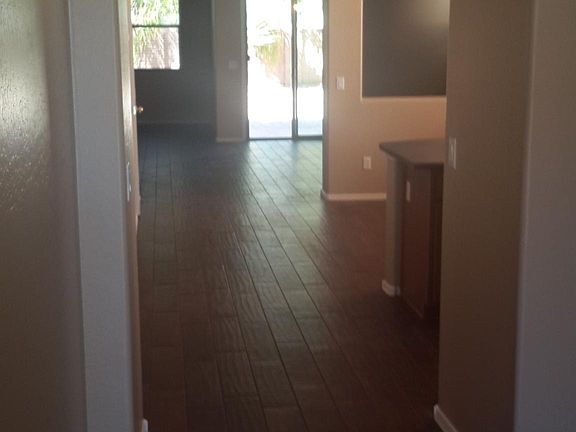 hallway, kitchen. family room, Patio door,den