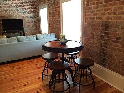 Keeping with the age of the building, this is an old table and stools