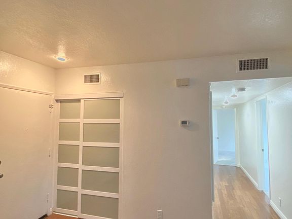 Extra closet and long hallway to leading to 2 spacious bedrooms and 2 full bathrooms.