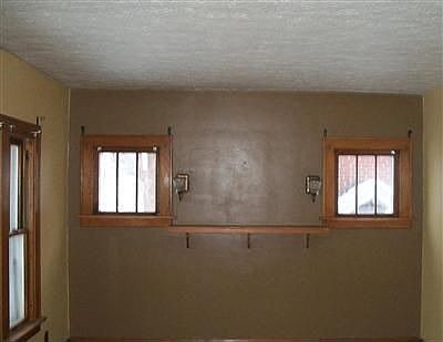 The living room, like the rest of the house, has all new windows and paint.