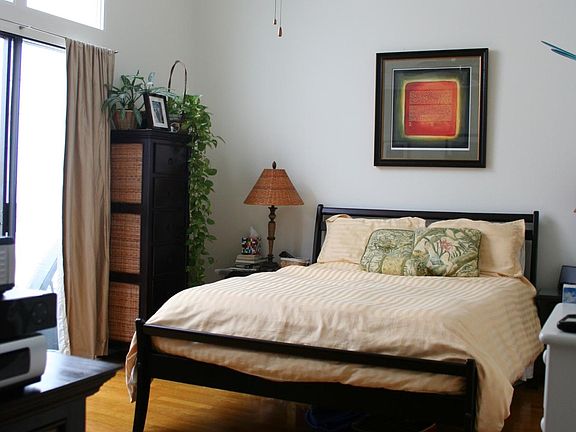 Master bedroom. The room has new flooring and light fixture today.