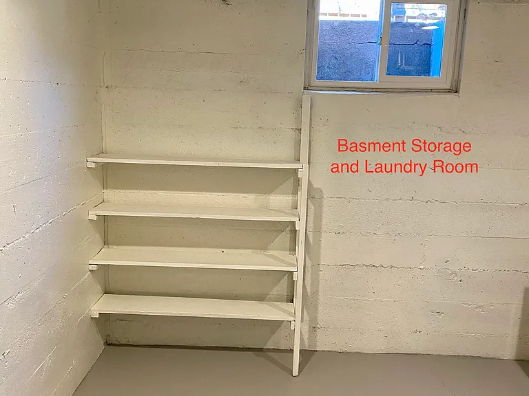 Basement storage and laundry room. Very clean. Includes an extra full sized fridge.