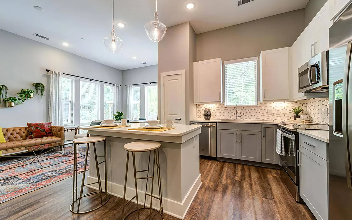 Photo 2 of 68 - Broadstone Trailside - Morrisville, NC Large Open Kitchen with Island Seating, Stainless Steel Appliances, and Pendant Lighting - Broadstone Trailside