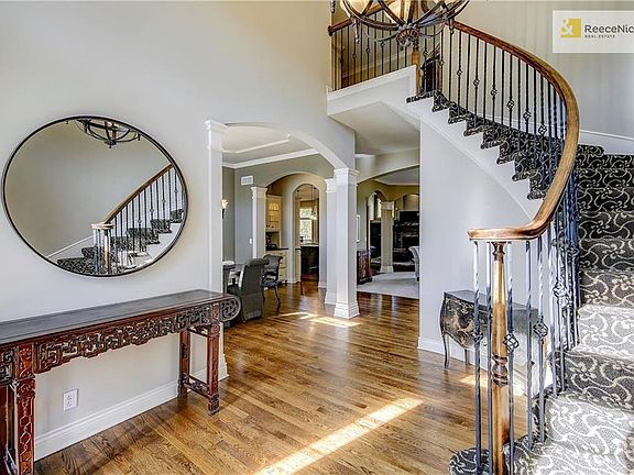 Entry opens to spacious main level and gorgeous stairs...