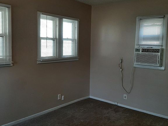 living room toward east wall at back of house