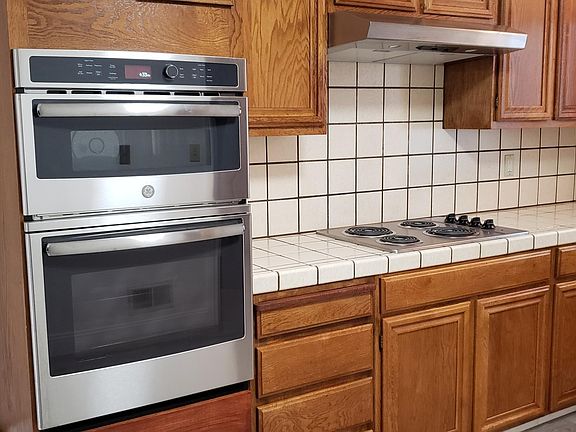 Kitchen. Built-in GE Profile microwave and oven, Electric stove top