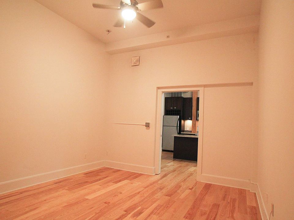 Ground floor "den". Can be used as a bedroom (but no closet, no window), office, workout space, dining room, etc
