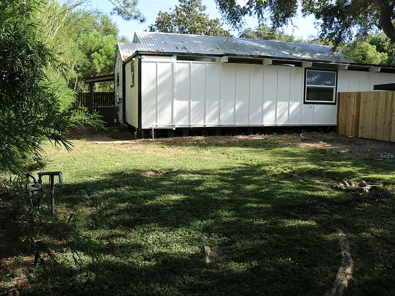 Spacious backyard with plenty of room for entertaining or play.