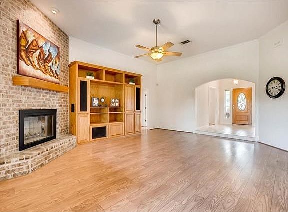Beautiful wood laminate flooring throughout home (except in entry and wet areas). Fireplace has a ga