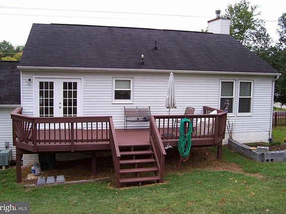 REAR VIEW OF HOME WITH DECK
