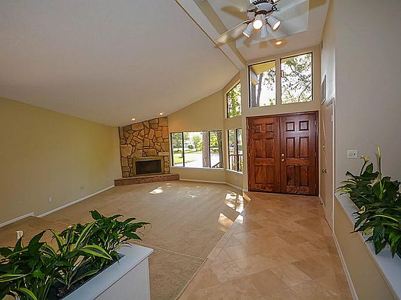 Dramatic foyer with high ceilings and skylights provides lots of natural light.