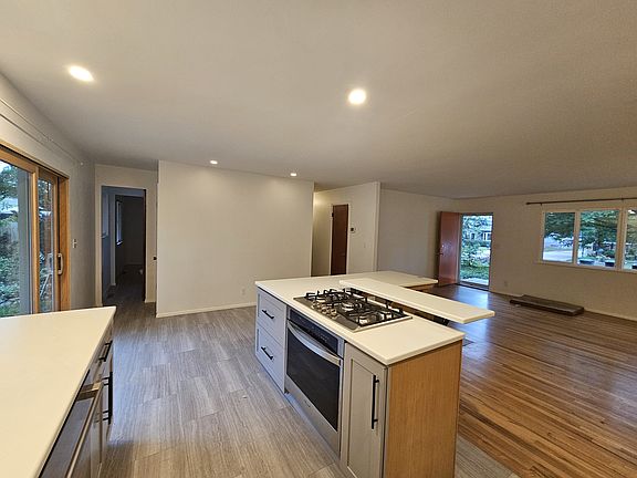 Island with oven, cooktop and storage