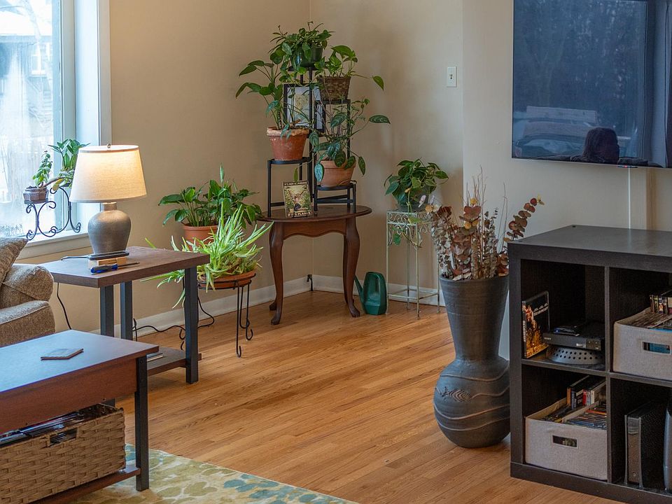 newly refinished wood floors, large picture window in front with remote controlled shade.