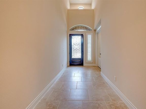 Grand entrance with high ceilings.