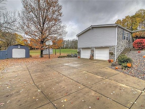 Concrete parking bib. Stone front / partial side. Plenty of space four all your toys!