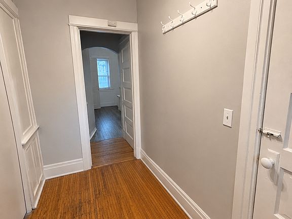 Entryway. Living room is to the left. Basement stairs to the right. Kitchen and bath straight ahead.