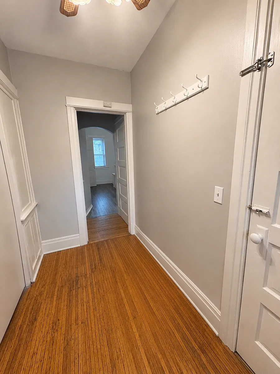 Entryway. Living room is to the left. Basement stairs to the right. Kitchen and bath straight ahead. - 7 Milburn St