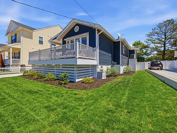 Front of the home and adjacent side yard.