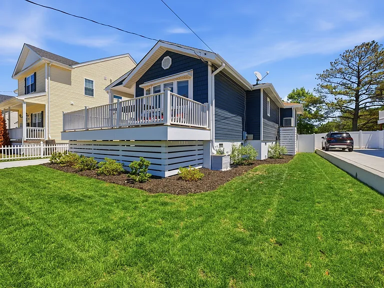 Front of the home and adjacent side yard.