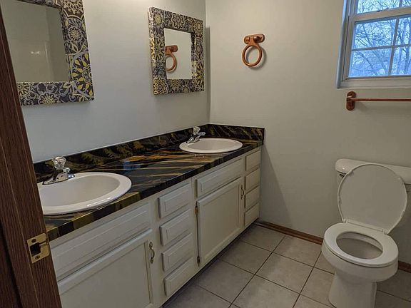 Double sink vanity attached to the large master bedroom upstairs