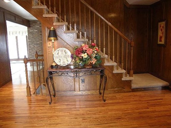 Formal Entry with Warm, Wood Floors