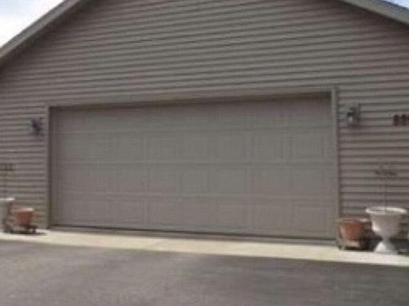 Garage and driveway off woodland drive