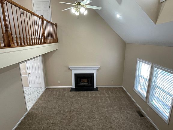Tall ceiling and fireplace in living room