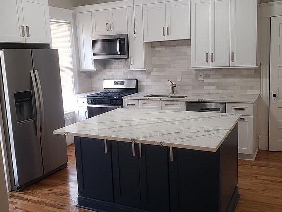 newly remodeled kitchen with all new stainless appliances