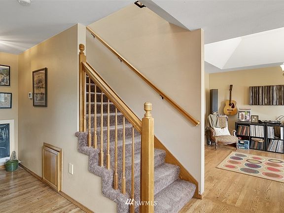 Entry Foyer. Upstairs to bedrooms. Living Room on right. Hallway to Kitchen/Family room on left.