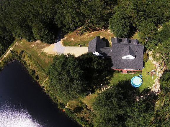 Aerial View of Home and Lake