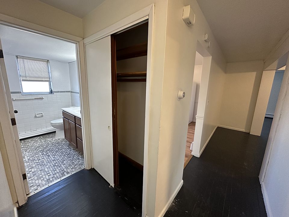 Hallway between the living space and the bedrooms, along with a closet for all your linens and more.