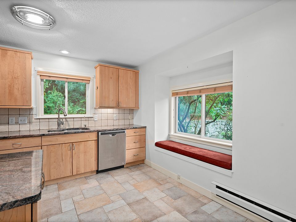Kitchen with stainless steel appliances, cabinet underlighting, plenty of counter and cabinet space