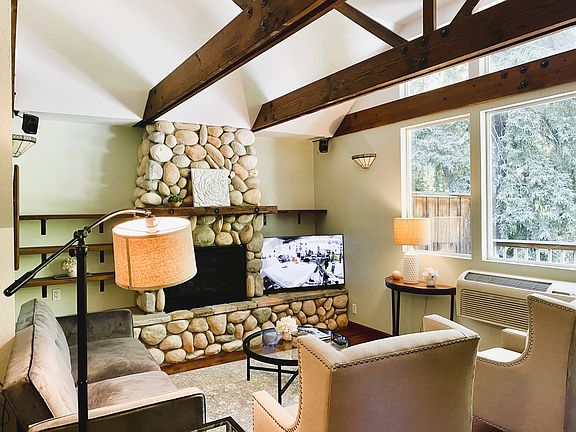 Stone gas fireplace and 50" Smart TV