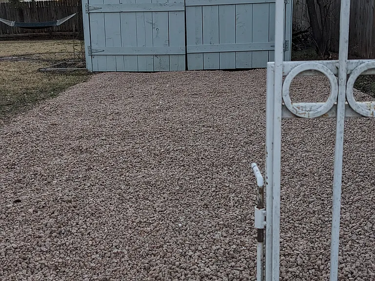 West driveway leading to a one-car garage. Access to the garage is free for all 30+ day rentals