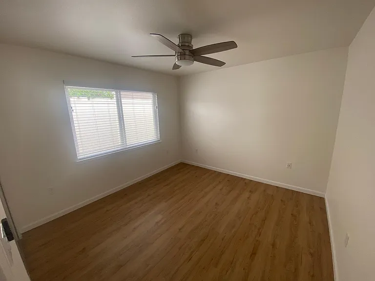 Bedroom#2 with sliding/mirror closet doors and new blinds.