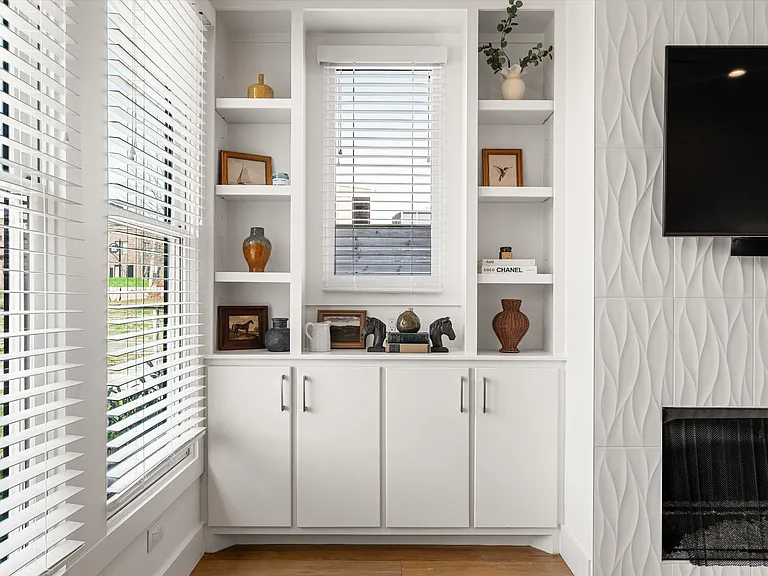 Open living area filled with natural light and seamless flow to kitchen and dining spaces.