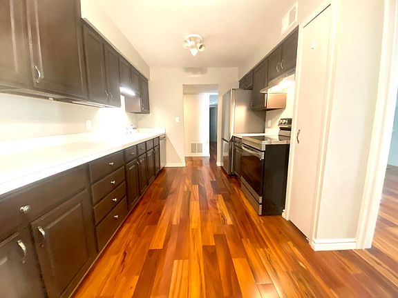 Spacious 2 Bedroom 1.5 Bath - Rochester, MI- Kitchen- Features: NEW! Samsung Smartthing appliances, freshly painted, plenty of cabinet storage and room for a kitchen table!