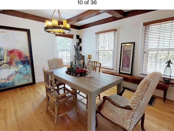 Dining room with lots of natural light, wall of windows lines family room and dining room