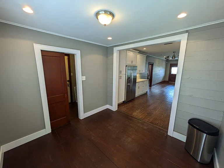 Large breakfast room located off kitchen and next to dedicated laundry/mud room. Can also be used as dining room or home office. Pocket door leads to laundry.