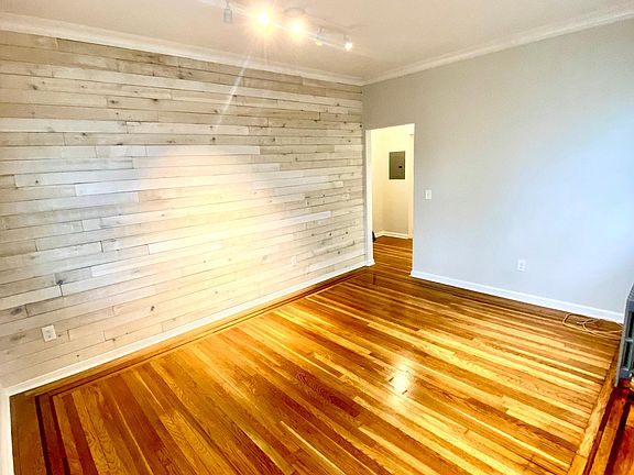 living room. newly renovated with accent wall and track lights