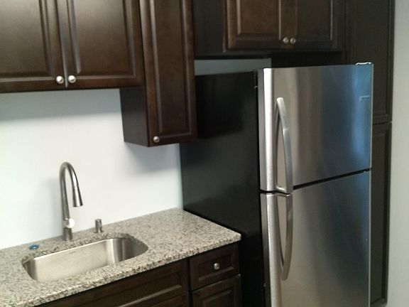 Left side of kitchen.